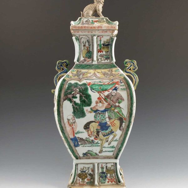 A famille verte covered vase, decorated with panels of warriors and foliage