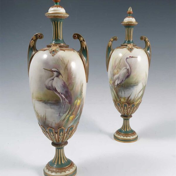 A pair of Hadleys Worcester covered vases, attributed to Powell
