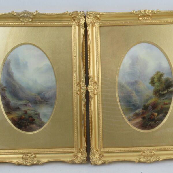 A pair of Royal Worcester oval plaques, decorated with Highland landscapes with cattle and figures, signed John Stinton